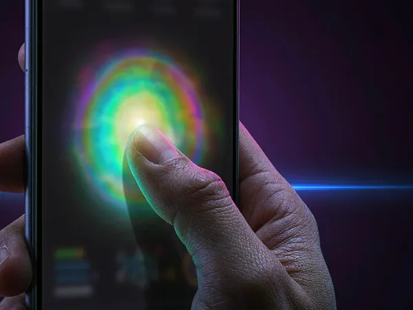cloudbet finger touching a glowing circle on a phone screen